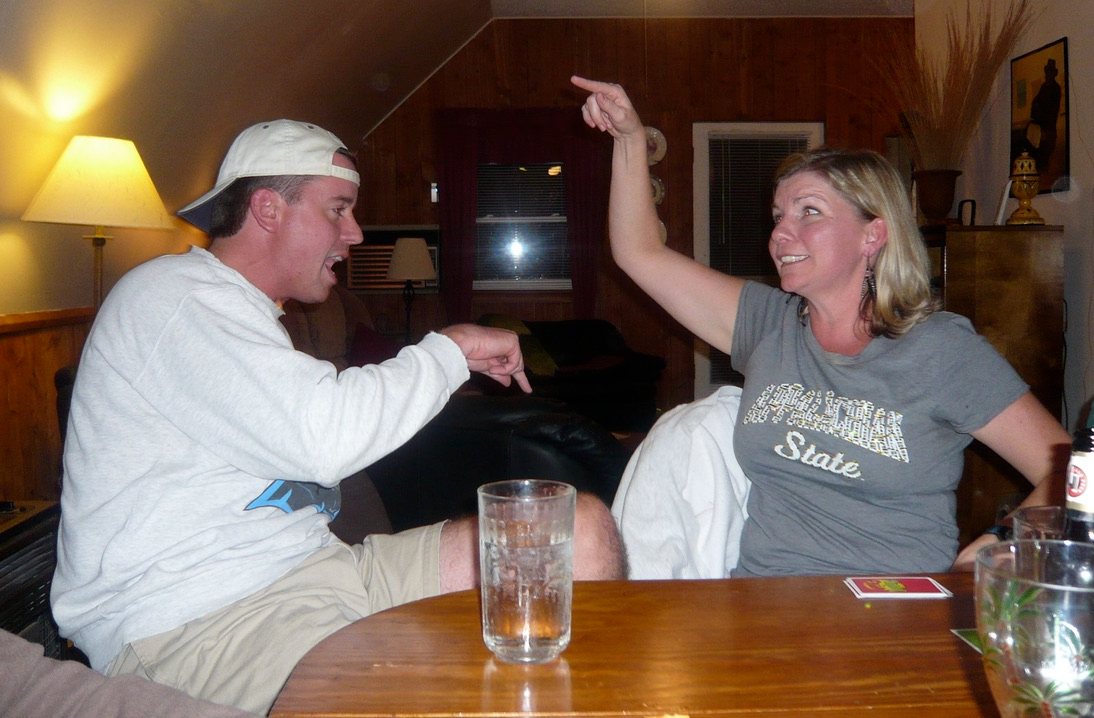 Seth and Donna mid-debate over a competitive family board game
